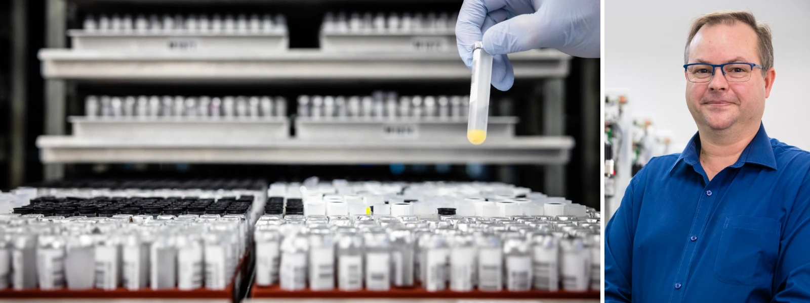 A gloved hand holds a test tube in a lab with many samples; a man in a blue shirt stands on the right side of the image.