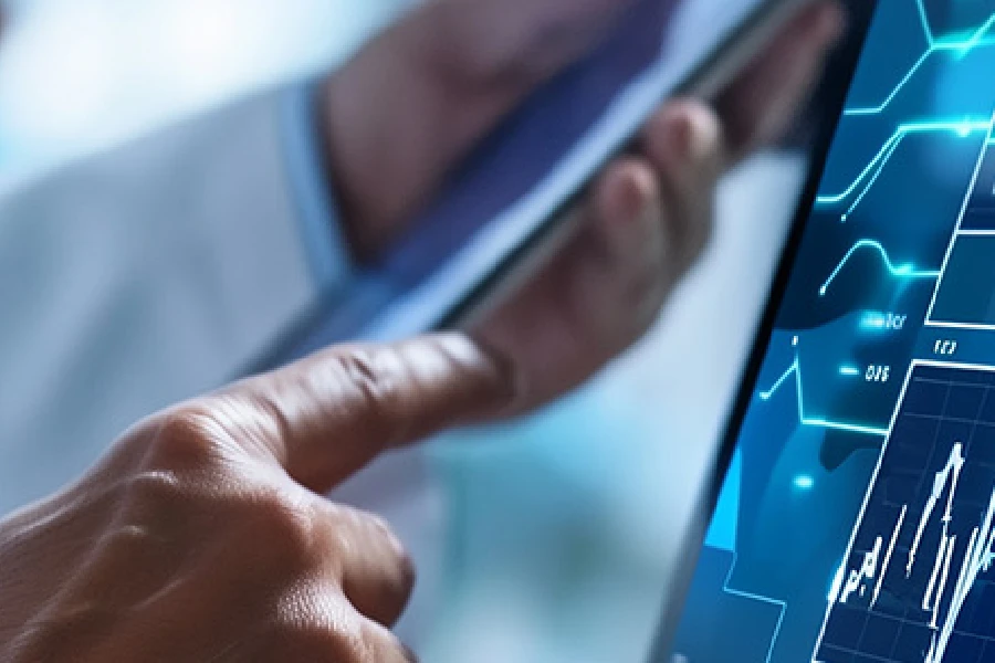 A person uses a tablet displaying various graphs and charts, indicating data analysis or financial monitoring on a digital device.